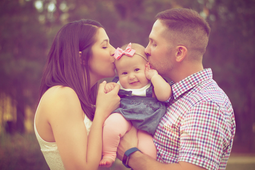 couple kissing kid