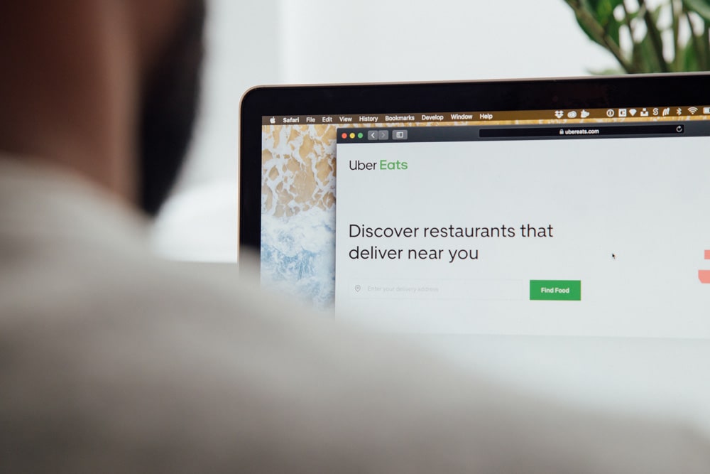 man browsing uber eats website