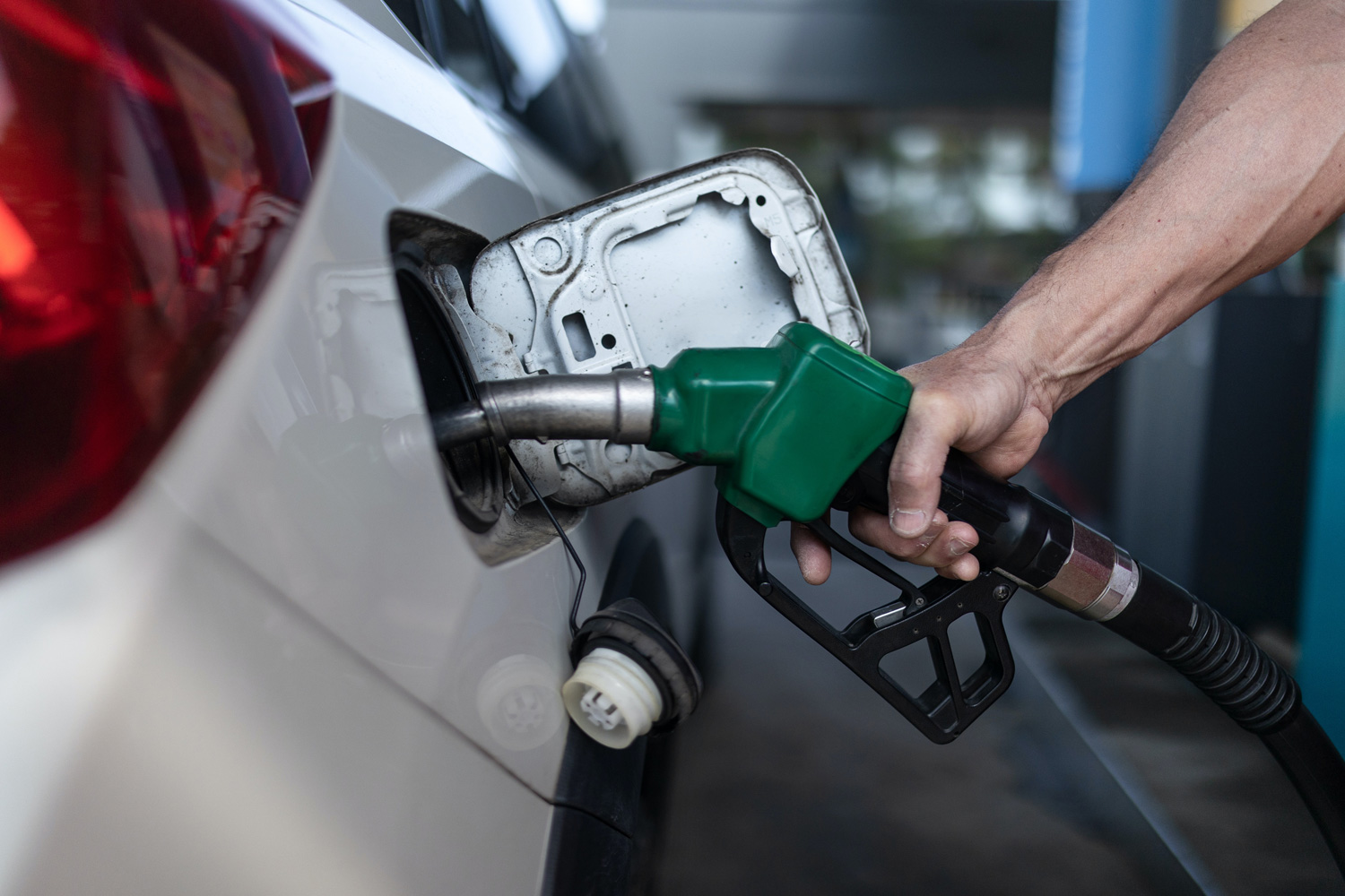 man pumping gas