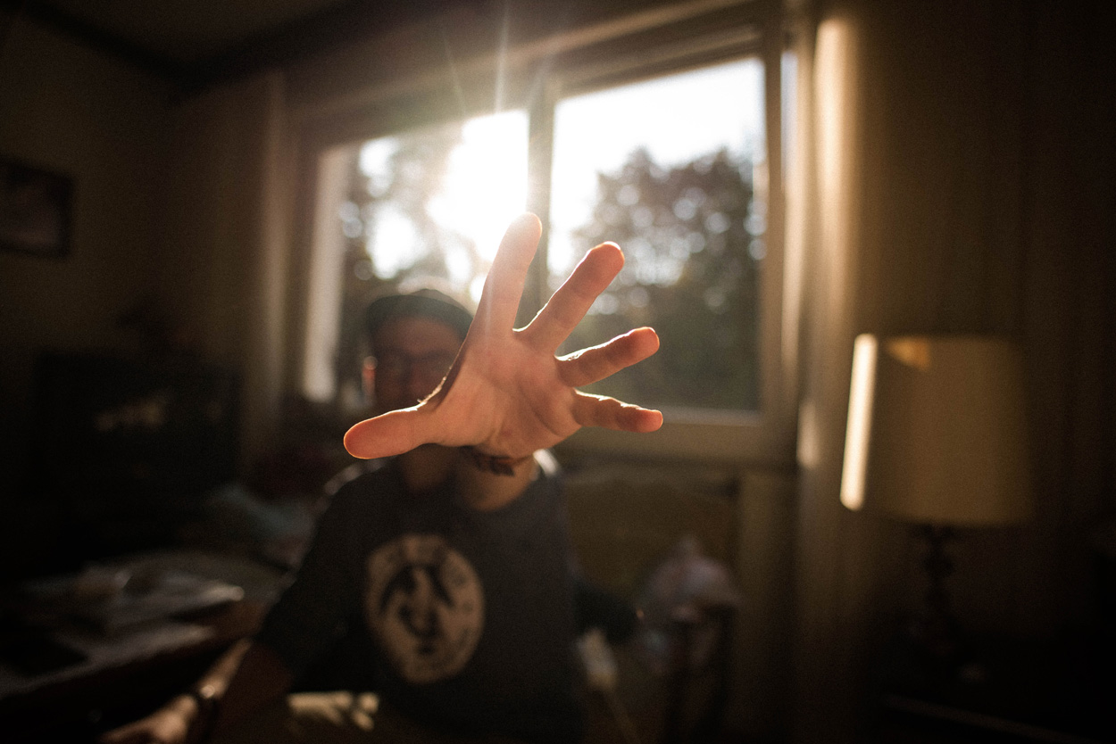 man reaching out with his hand