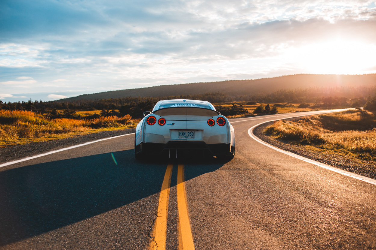 silver sports coupe on the road