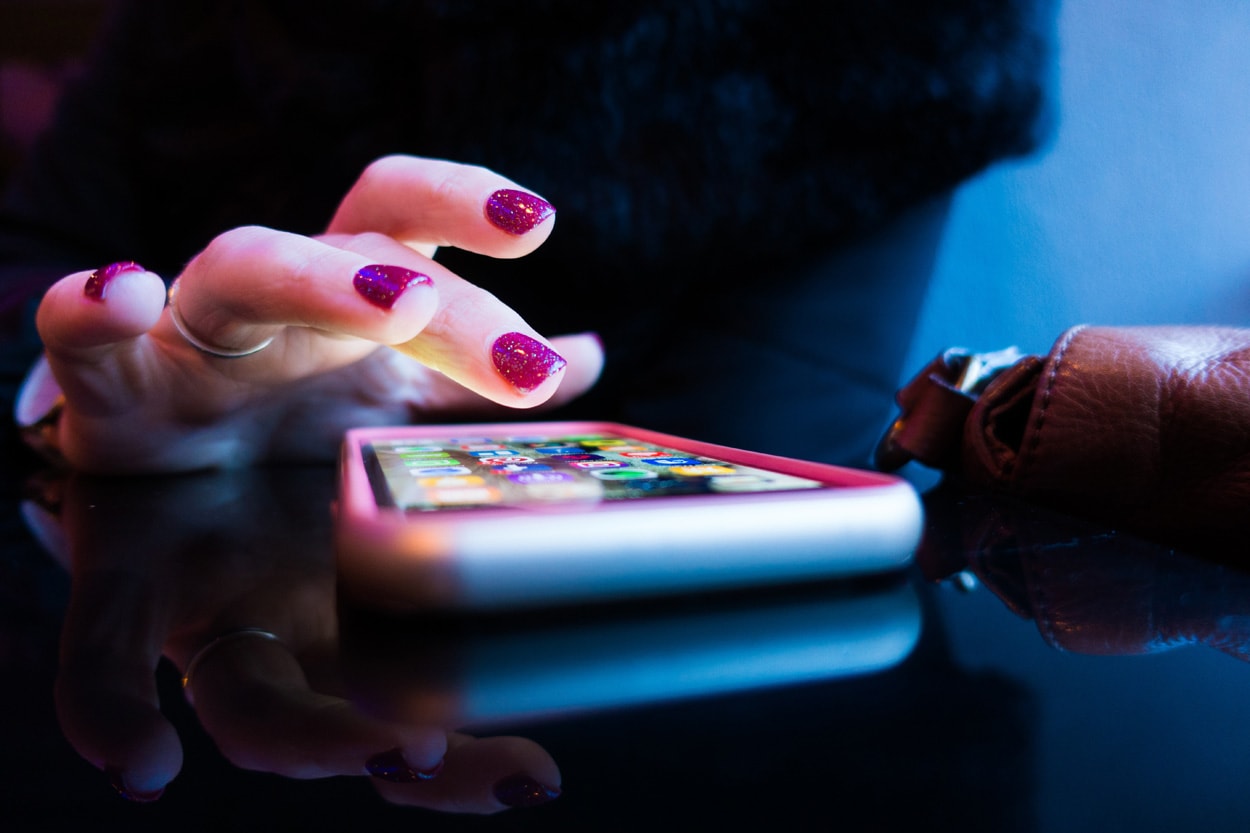 woman using smartphone apps